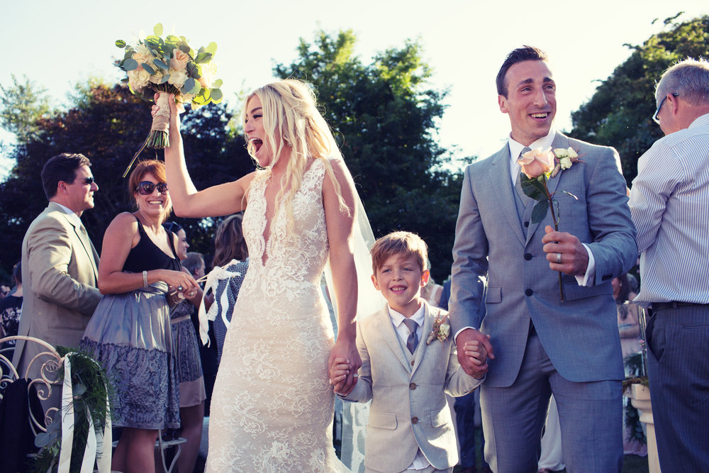 Brad Marchand along with his wife Katrina and son during their wedding in 2015