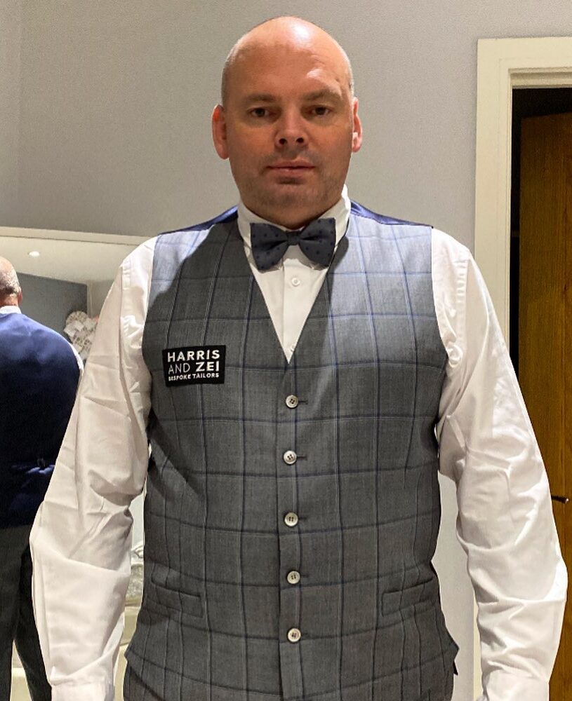 Stuart Bingham in a waist coat, probably getting ready for a match