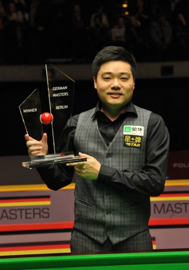 Ding Junhui posing after he won the 2014 German Masters