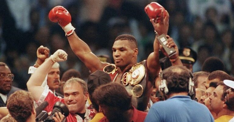 Mike Tyson celebrates after winning championship match