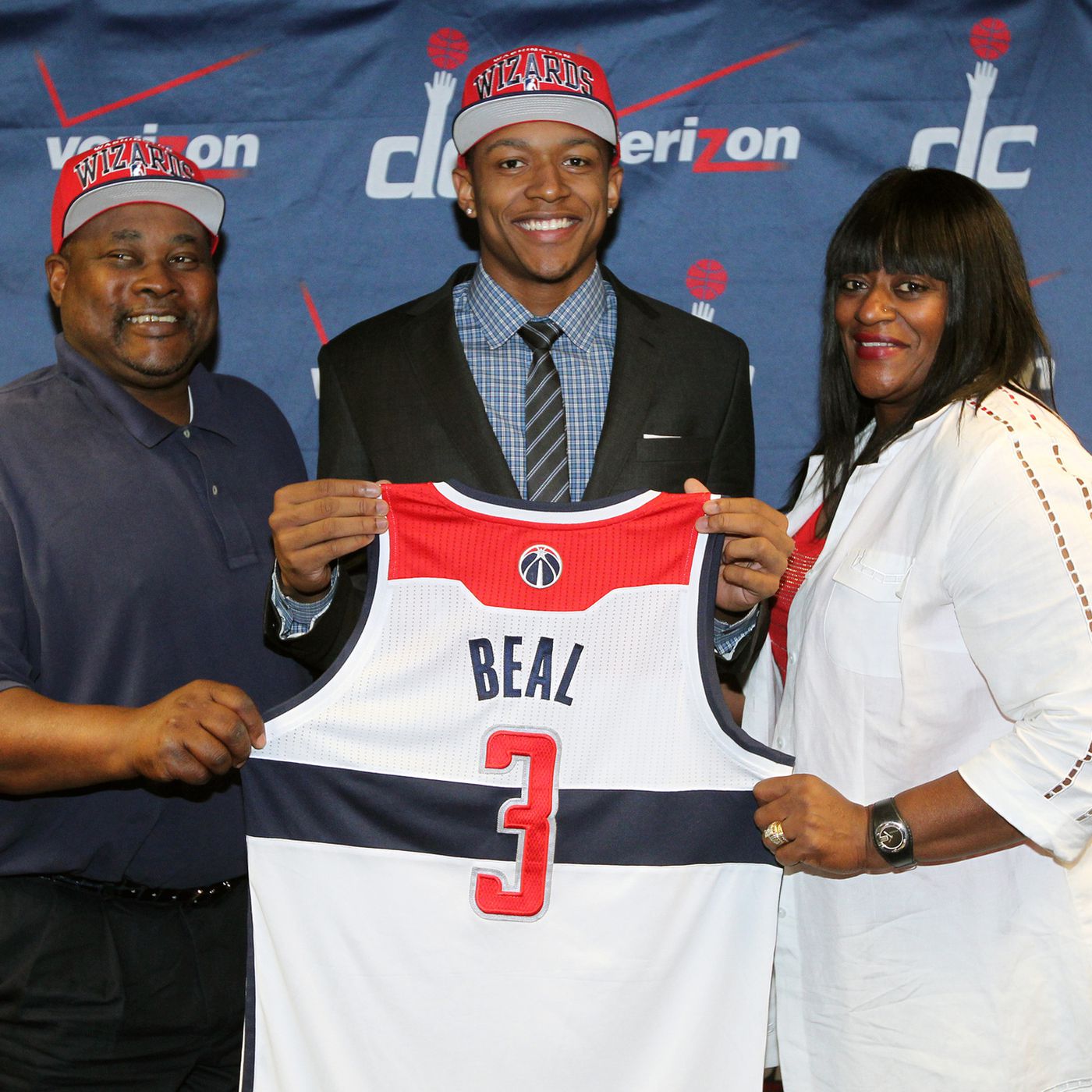 Bradley Beal with his father Bobby Beal and Mother Besta Beal revealing his number 3 shirt for the Washington Wizards