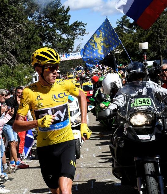 Chris Froome running after his bike crashed into a motorbike