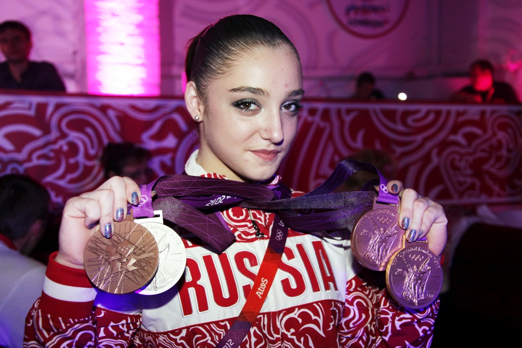 Aliya Mustafina with her Olympic medals 