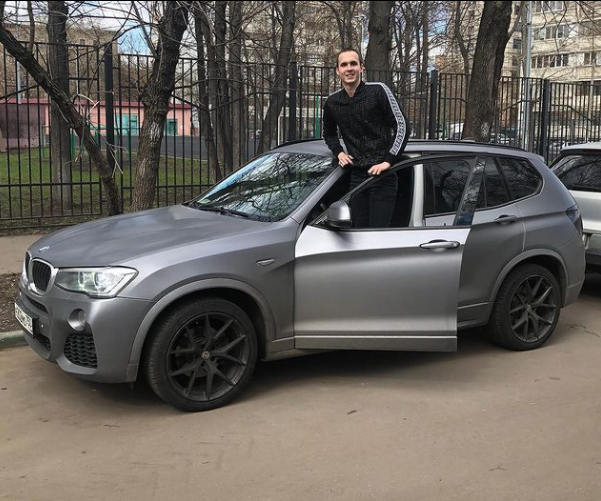 Anton with his brand new BMW