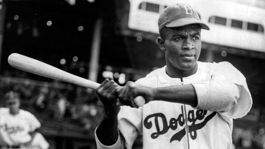 Jackie Robinson playing baseball for Brooklyn Dodgers