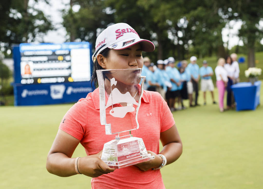 Nasa and her LPGA winner's trophy