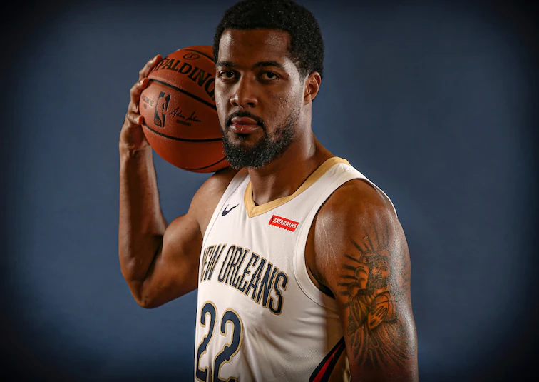 Derrick Favors with basketball.