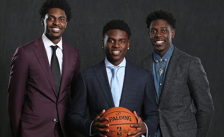 Jure Holiday with his brothers, Justin & Aaron Holiday 