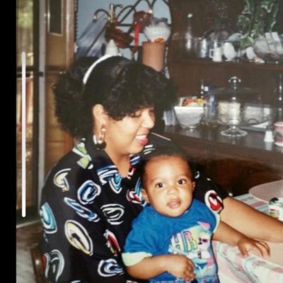 Derrick Favors and his mother.