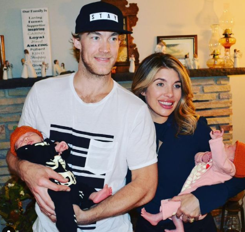 Justin Peters with his wife, Kelly Sarah Johnson, and twins