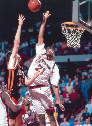 Marcus Camby playing basketball for Umass