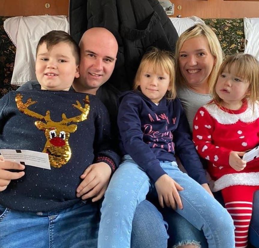 Rob Cross with his wife and kids