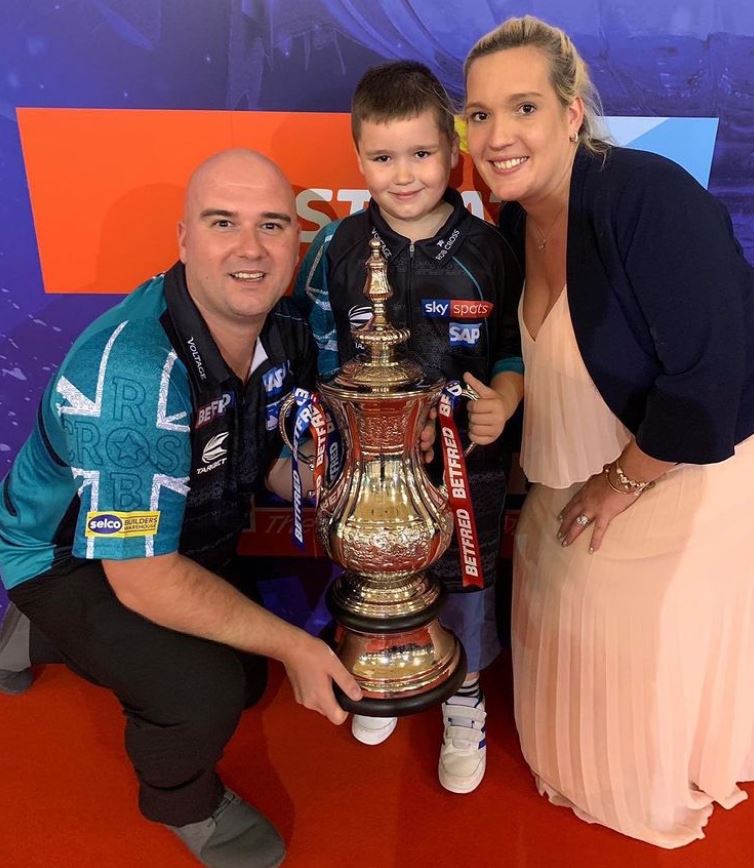 Rob Cross with his wife and son