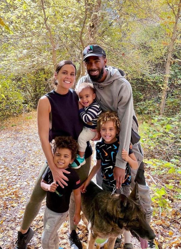 The Conley Family On The Outskirts With Their Pet