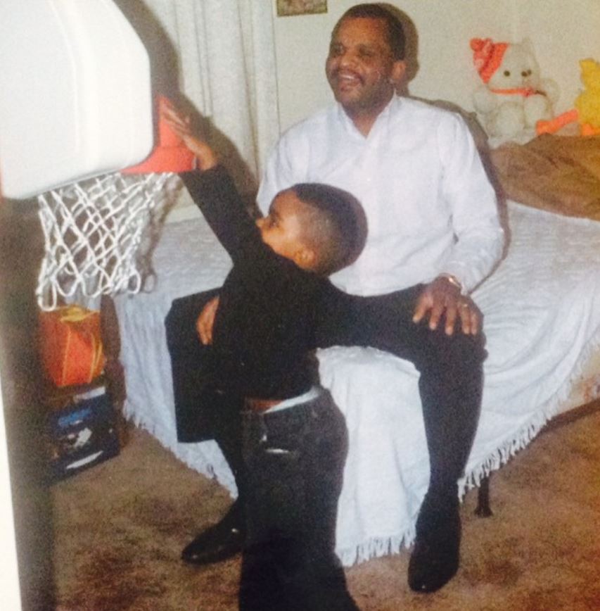Young Troy Daniels with his father