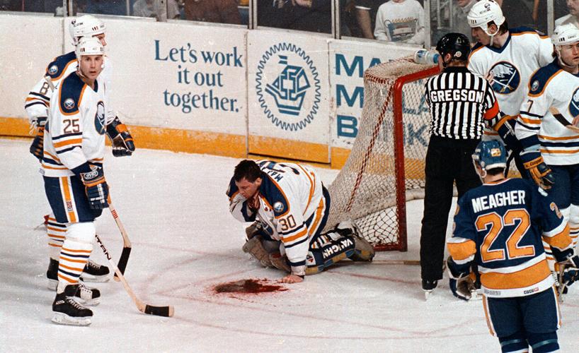 Clint Malarchuk clutching his throat after his neck was sliced