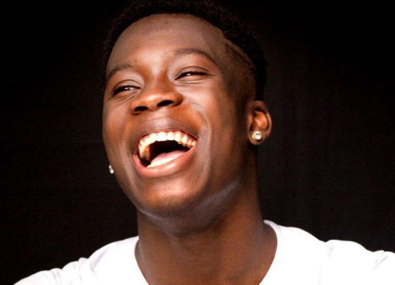 Kostas Antetokounmpo Smiling In A Portrait