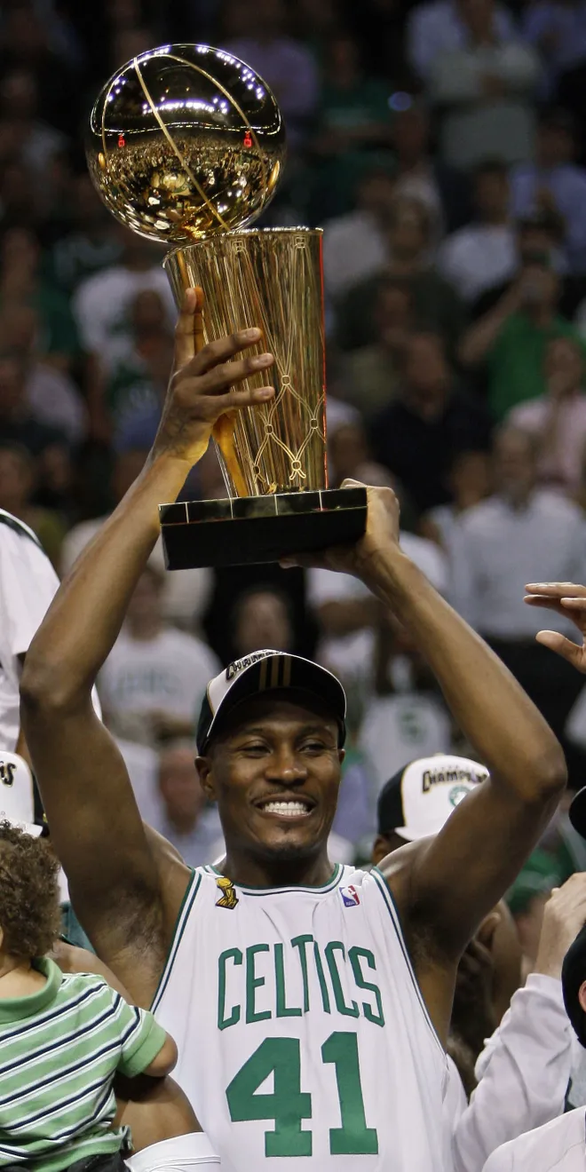 Posey with the NBA championship trophy with Boston Celtics (Source: patriotledger.com)