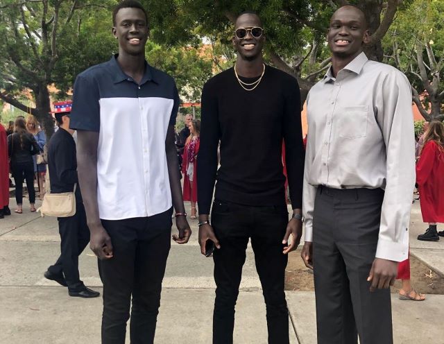 Thon (Center) With His Brother, Matur, And His Cousin, Makur