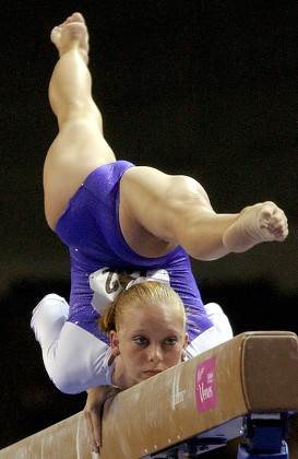 Alexander's wife Hollie Vise performing on beam (Source: Morry Gash/AP/Shutterstock)