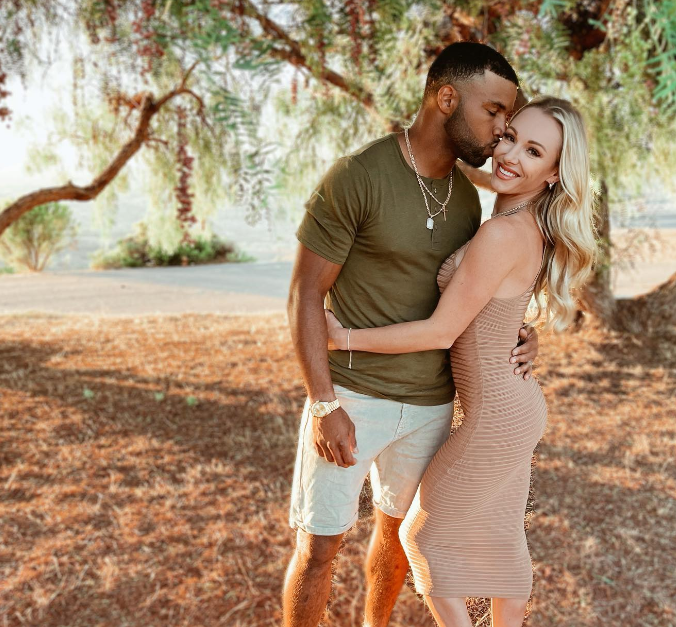 Golden Tate And His wife Elise Kissing And posing 