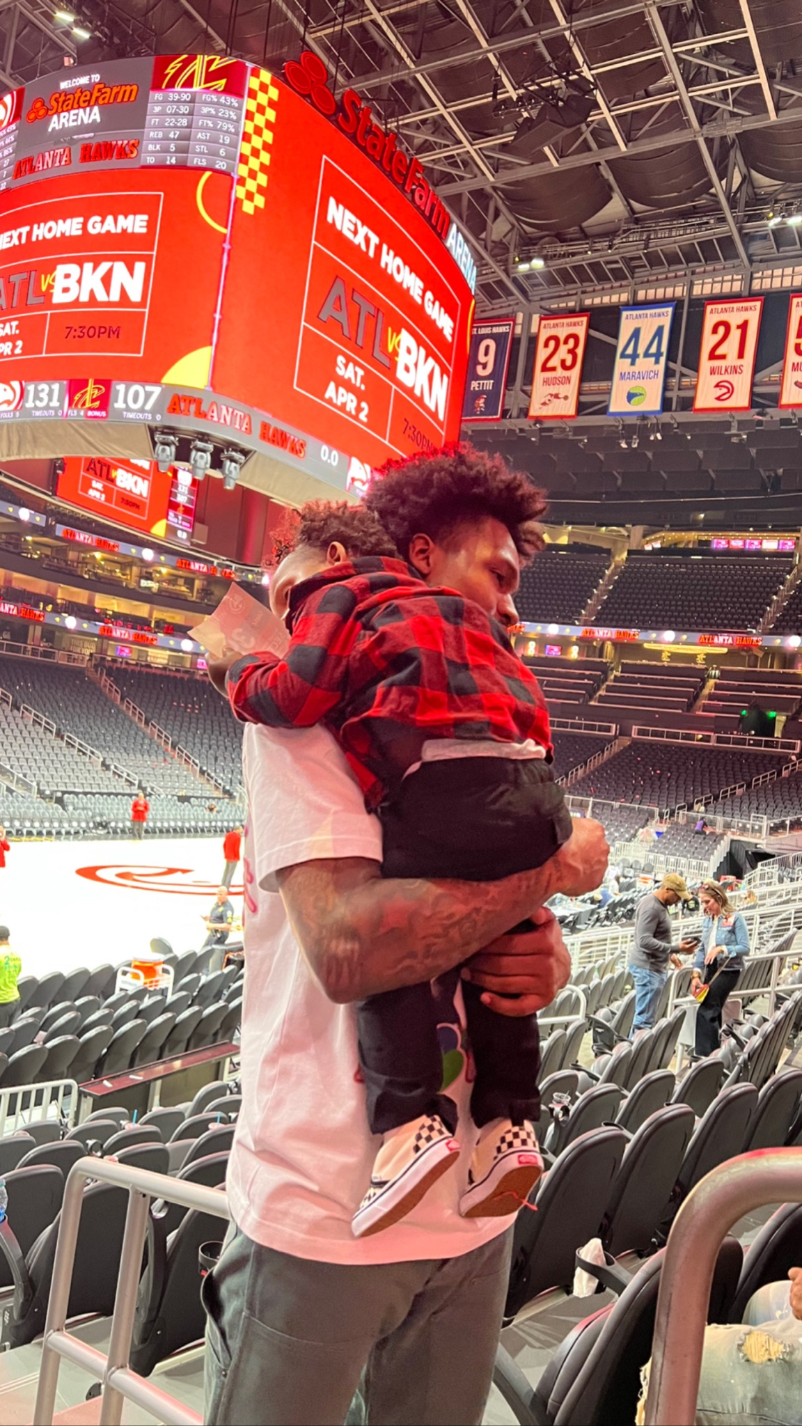 Brandon carrying his son