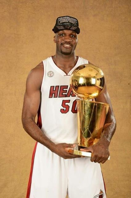 Joel Anthony holding the trophy 