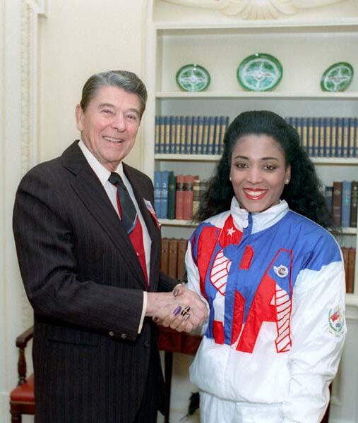 President Reagan greeting Florence Griffith Joyner of the U.S. Olympic team in the Oval Office, October 24, 1988