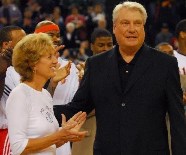 A former coach with his wife