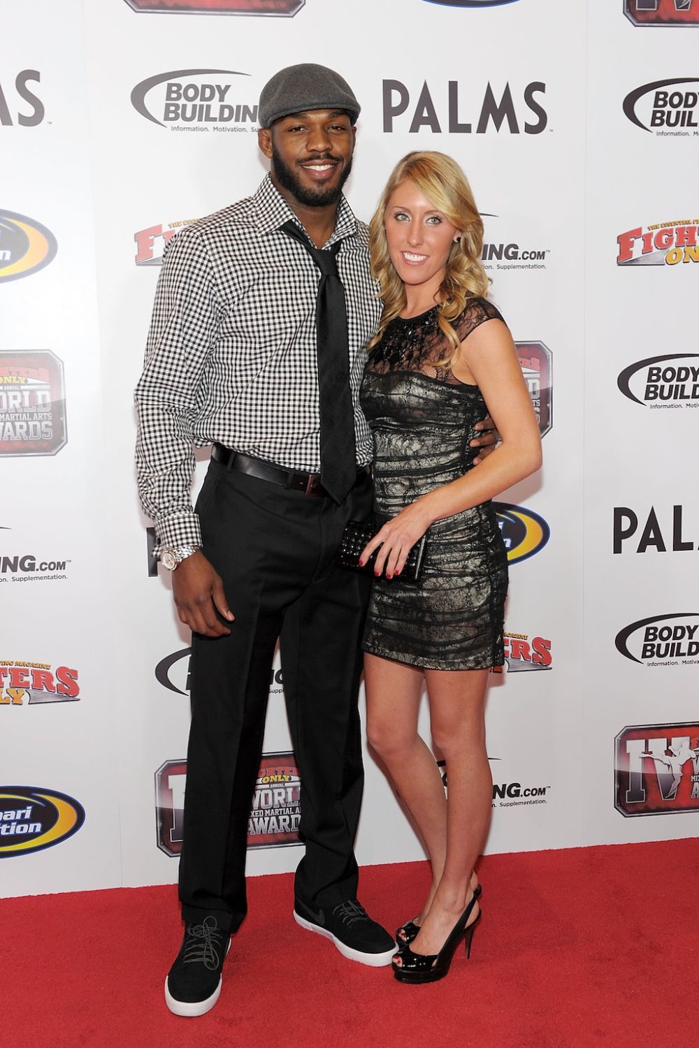 Jessie Moses Standing With Her Husband, Jon Jones, At An Event 