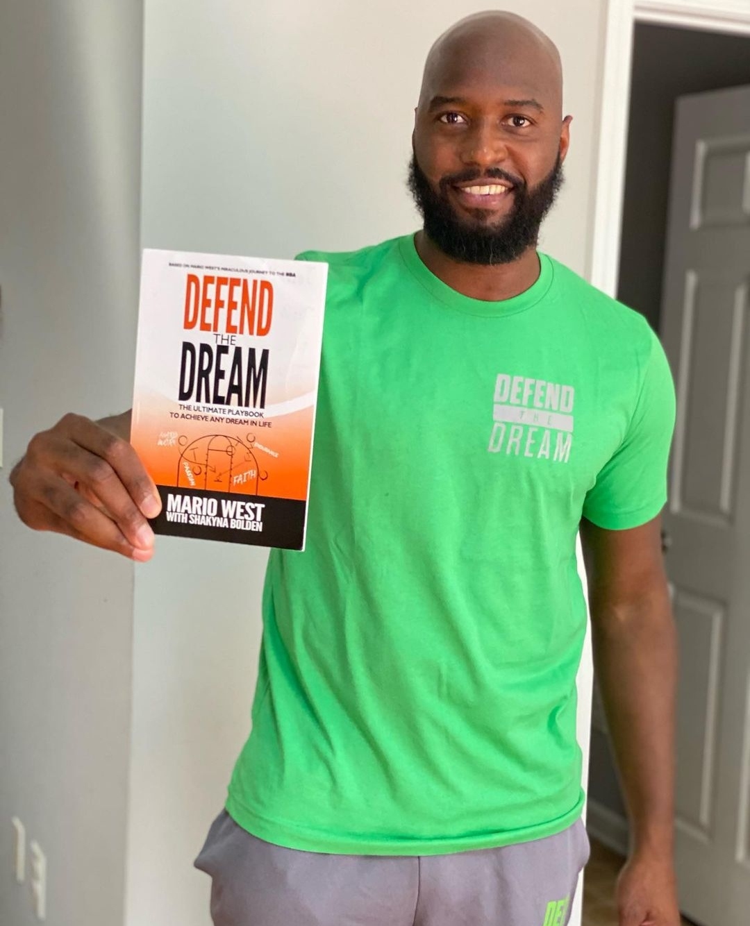 Mario with his book, Defend The Dream