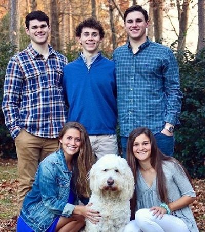 Morgan Reid with her siblings and pet dog