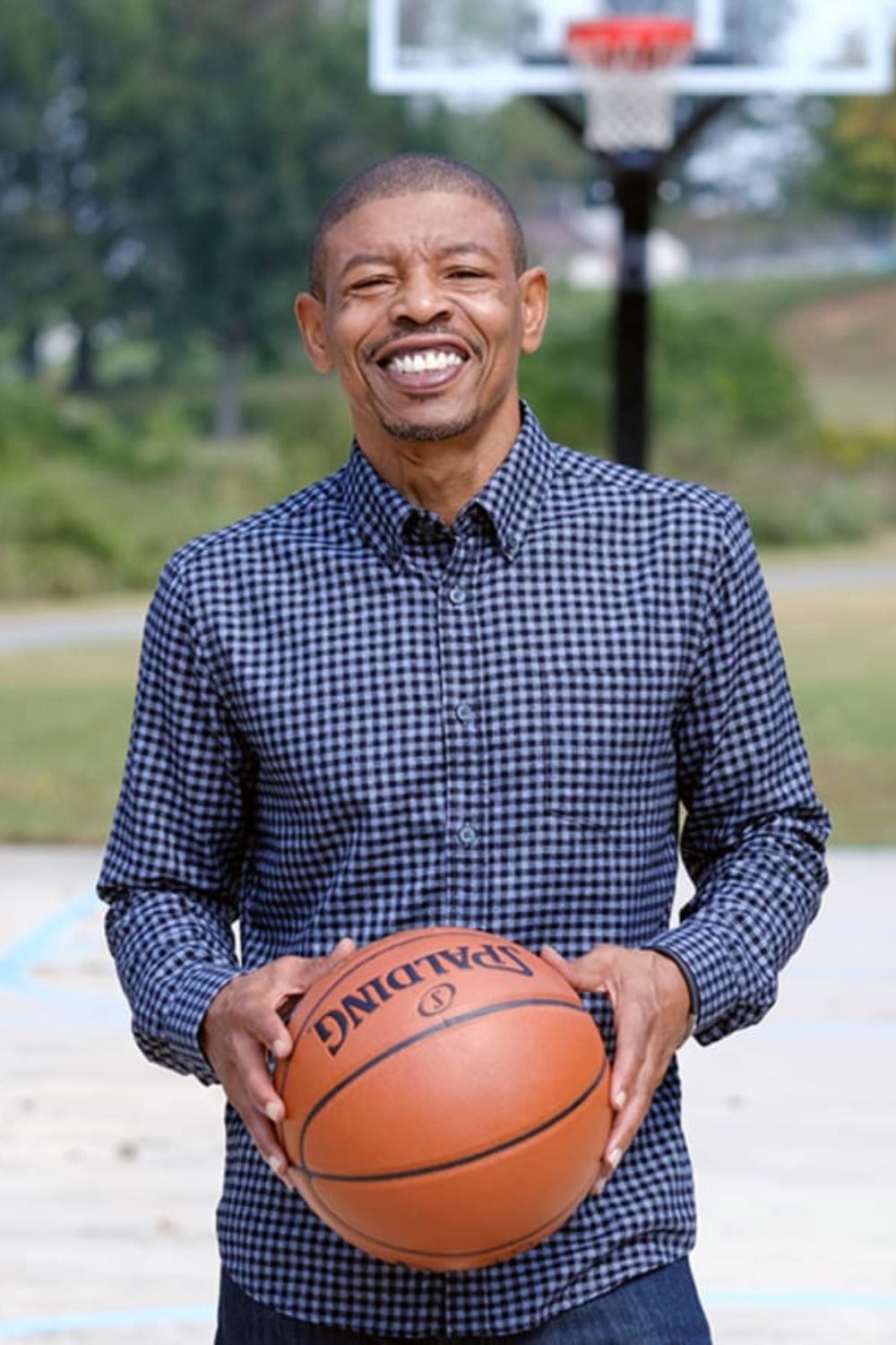 Muggsy Bogues Holding Basketball