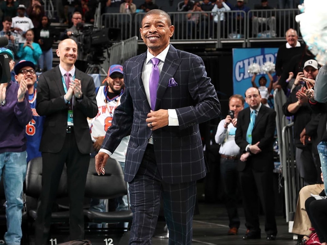 Muggsy Bogues In A Suit Attending An Event