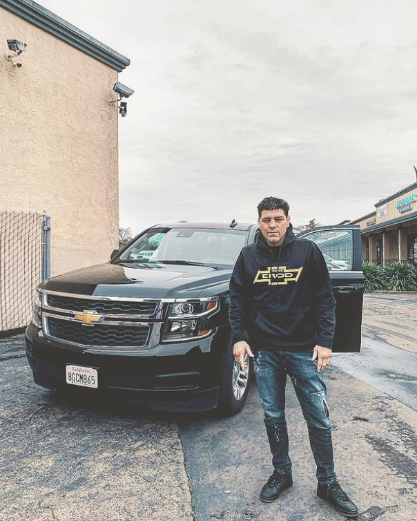 MMA Fighter Posing With His Car 