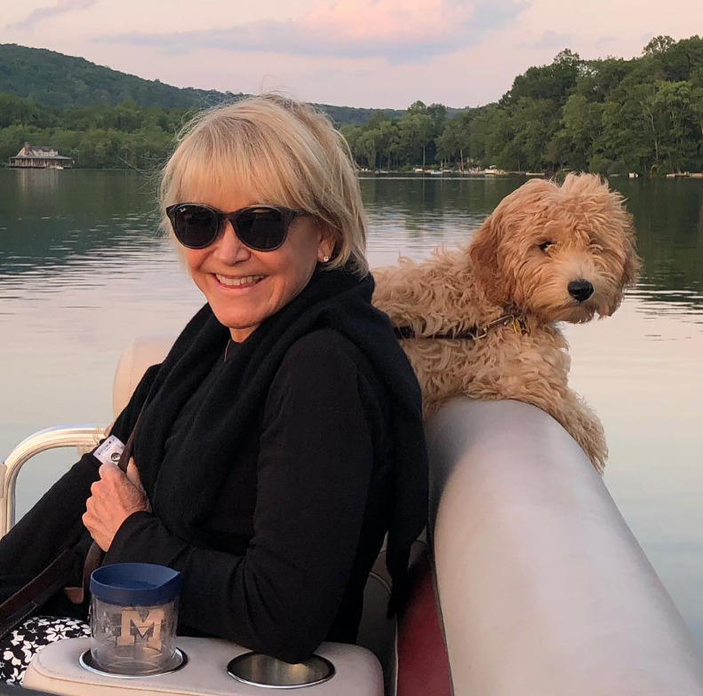 Joyce And Her Dog Enjoying The Boat Rid