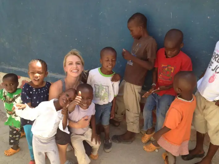 Laura Cover With Children She Works With Through Charities