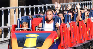 Blake in roller coaster with his kid