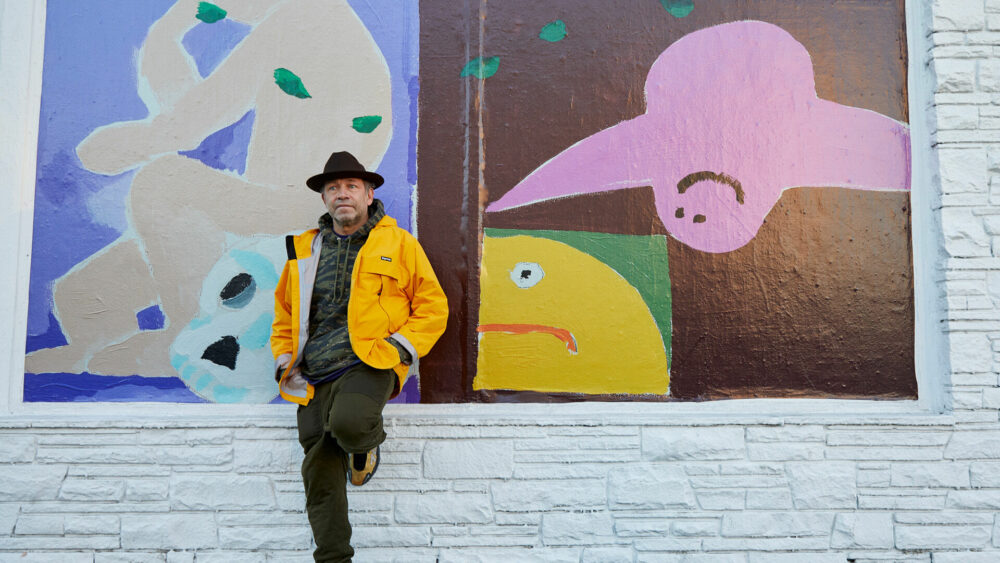 Mark Gonzales In Front of His Artwork 