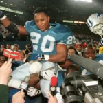 Barry Sanders being carried off by his teammates