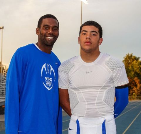 Thaddeus with his father Randy Moss