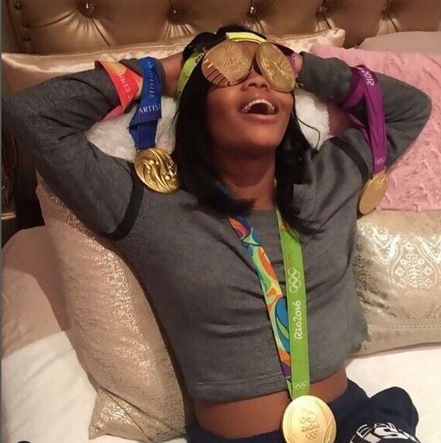 Gabby Douglas flaunting Her Gold Medal With her Followers 