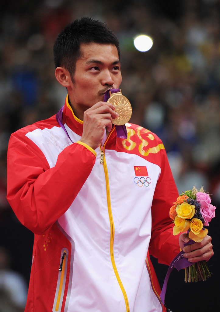 Lin Dan Holding His Gold Medal At The Olympics (Source: Zimbio)