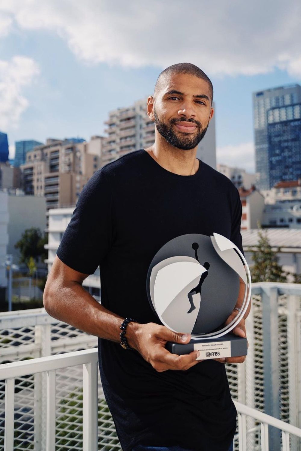 Nicolas Batum Holding An Award On His Hands