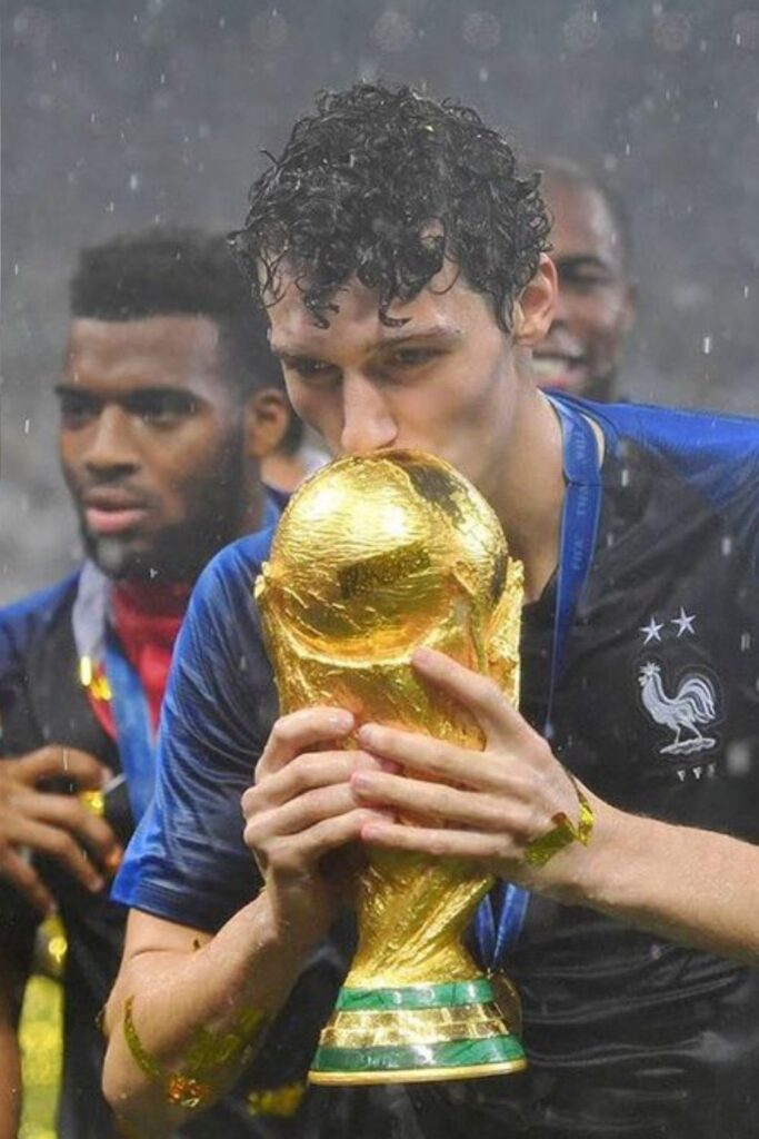 Benjamin Pavart kissing the FIFA World cup 2018 after theri victory over Croatia