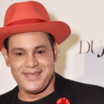 Sammy Looking Dashing  In Black Coat And Red Hat