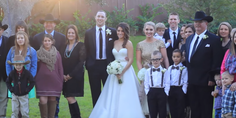 Philip And Her Wife Chelsy McDaniel Posing At Their wedding
