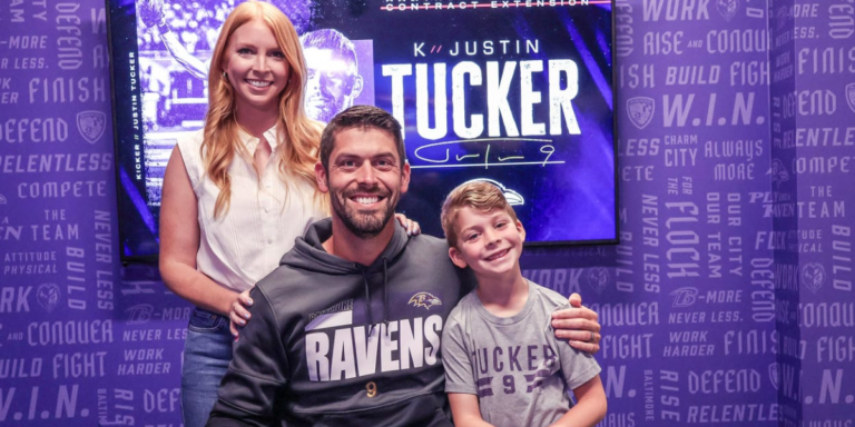 Justin, His Wife And Son Posing for Ravens
