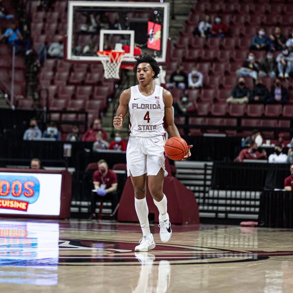Scottie Barnes standing at 6 feet 8 inches in a basketball game