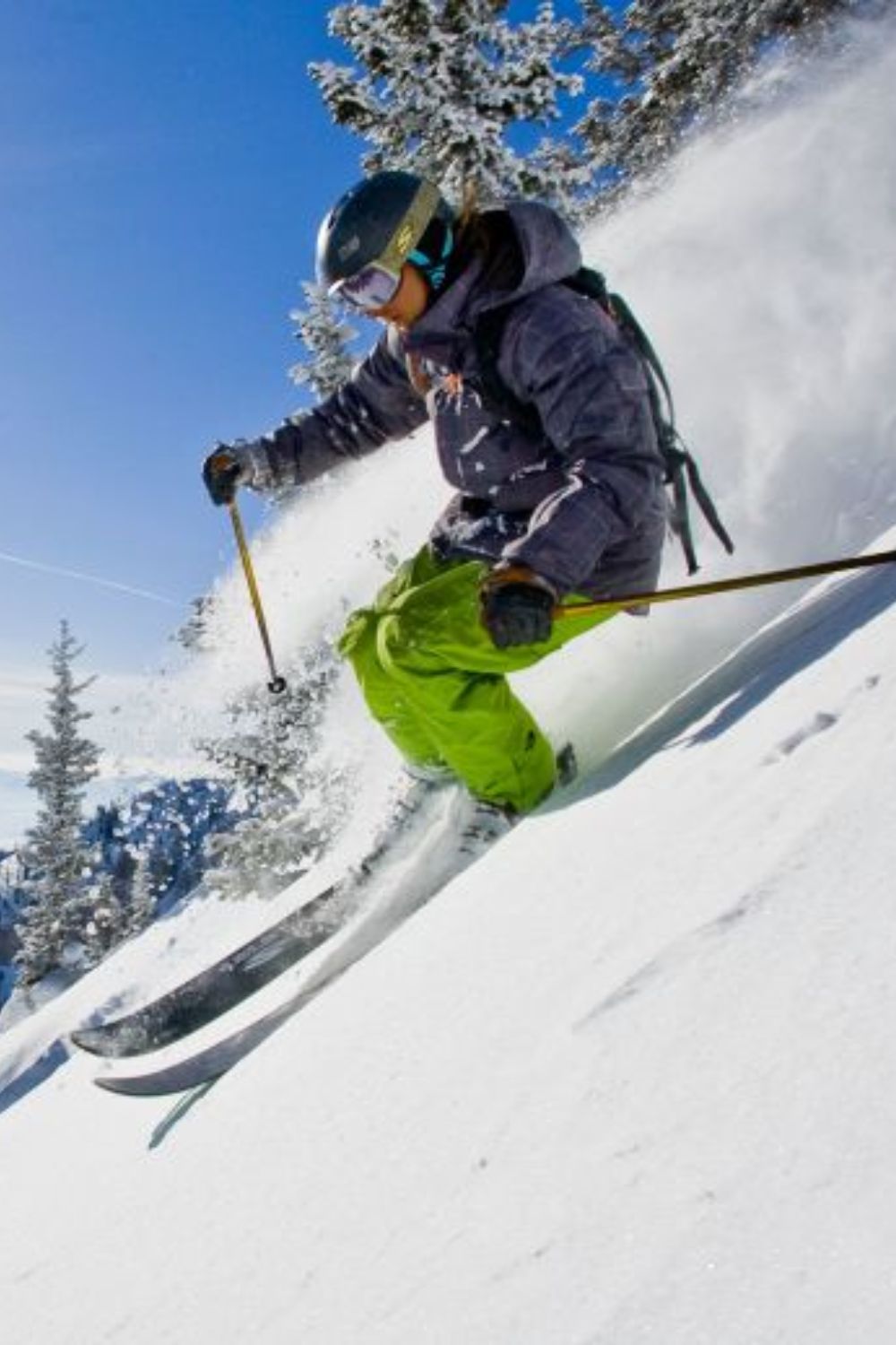 A Women Skiing Down The Mountain